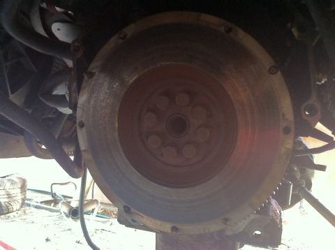 1993 Ford Taurus - Flywheel and clutch assembly detail, likely from a vehicle's engine bay.