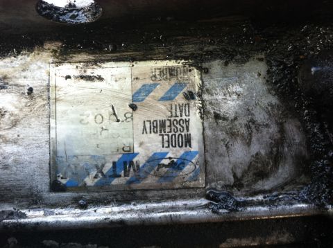 1993 Ford Taurus - A close-up view of a vehicle's identification label, showing assembly information and the 'MTX' designation.