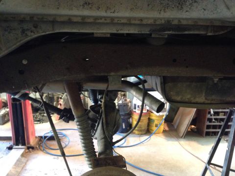 1979 Ford Bronco - Close-up of the undercarriage, focusing on the frame and exhaust system.