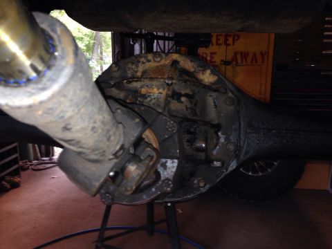 1979 Ford Bronco - Underside view of a vehicle's rear axle differential and driveshaft, showing significant rust.