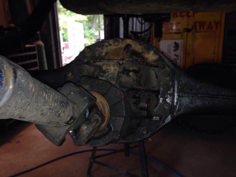 1979 Ford Bronco - The rear axle differential and driveshaft are shown in this close-up view, likely undergoing maintenance.