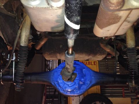 1979 Ford Bronco - Underside view shows the rear axle and driveshaft assembly of a vehicle.