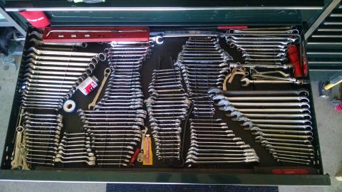 1994 Ford Bronco - A collection of various wrenches are neatly organized in a toolbox drawer. The tools are arranged by size and type, with some smaller acces…