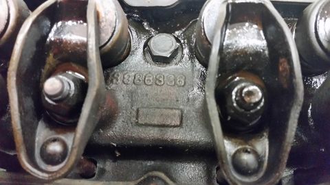 2015 Chevrolet new - A close-up view of a cast iron engine component with the number "3886336" stamped into it. The image shows several rocker arms and a bolt h…