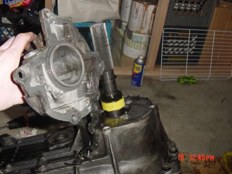 1987 Ford Bronco - Remove the 4 torqx bolts then the tailshaft cover comes off to reveal the vss gear and some kinda rubber gaurd