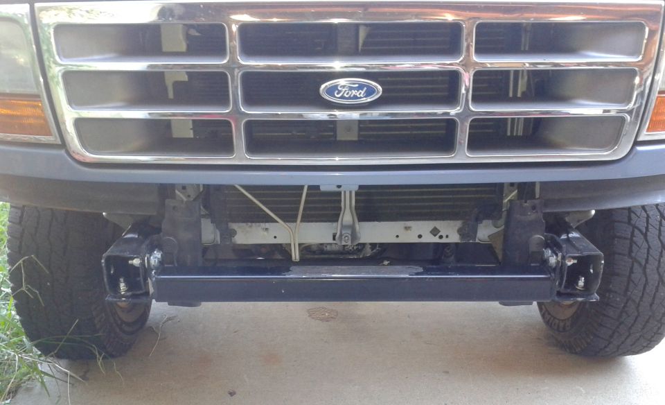 Front hitch receiver on a 1996 Ford Bronco. Grille has Ford logo