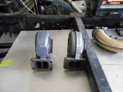 1992 Ford Bronco - Two turbochargers and exhaust piping are visible, with a vehicle frame in the background.