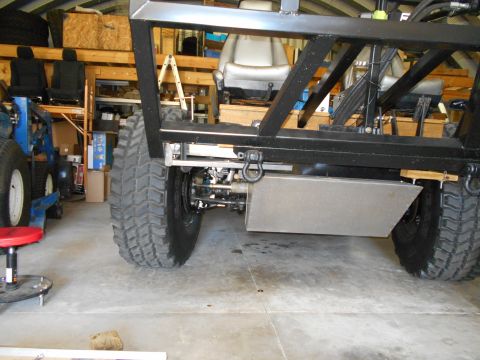 1992 Ford Bronco - Custom off-road vehicle chassis under construction, showing suspension and large tires.