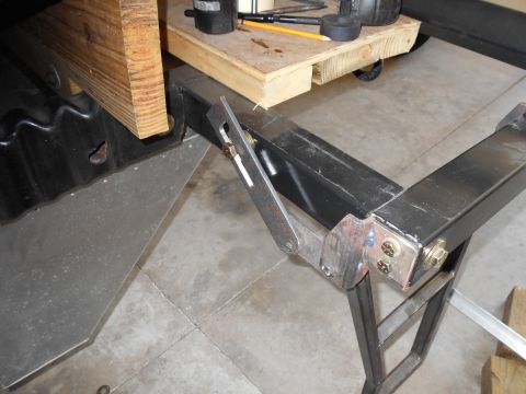 1992 Ford Bronco - A close-up view of a metal bracket and frame, with wood positioned overhead. The image contains text from SuperMotors.net.