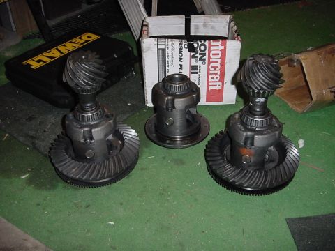 1989 Ford Bronco - Three differential assemblies are displayed, one in a Motorcraft box, suggesting they are replacement parts.