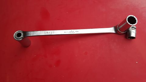 1965 Ford Mustang - A MAC 15/16 wrench is shown with a socket attached to one end.