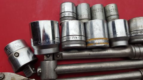 1965 Ford Mustang - Close-up of a socket set, including various sizes of Craftsman sockets and a ratchet.