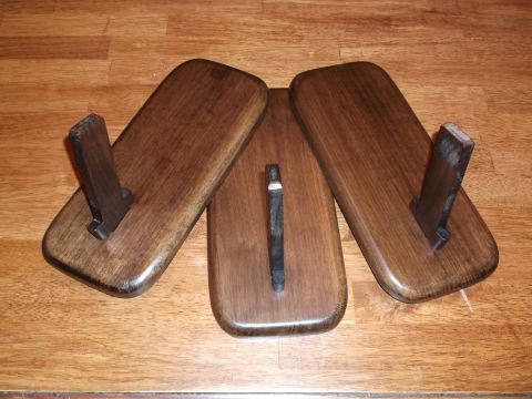 1995 Mercury Grand Marquis - Three wooden display stands with metal uprights are shown on a wooden floor. The registry label indicates a 1995 Mercury Grand Marquis, whi…