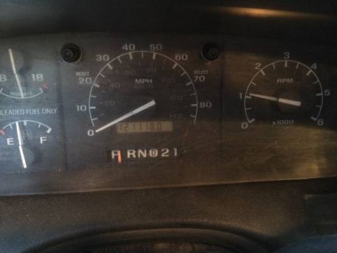 1994 Ford Bronco - The dashboard displays the odometer reading of 121,118 miles, along with fuel and tachometer readings.