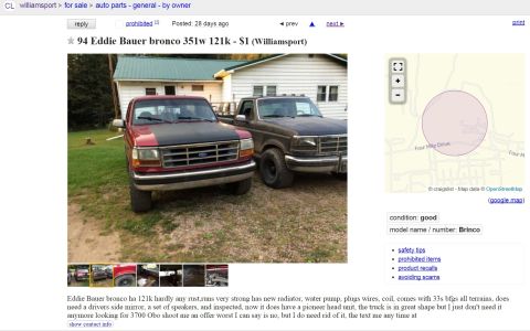 1994 Ford Bronco - Two Ford trucks are parked in a grassy area in front of a house.