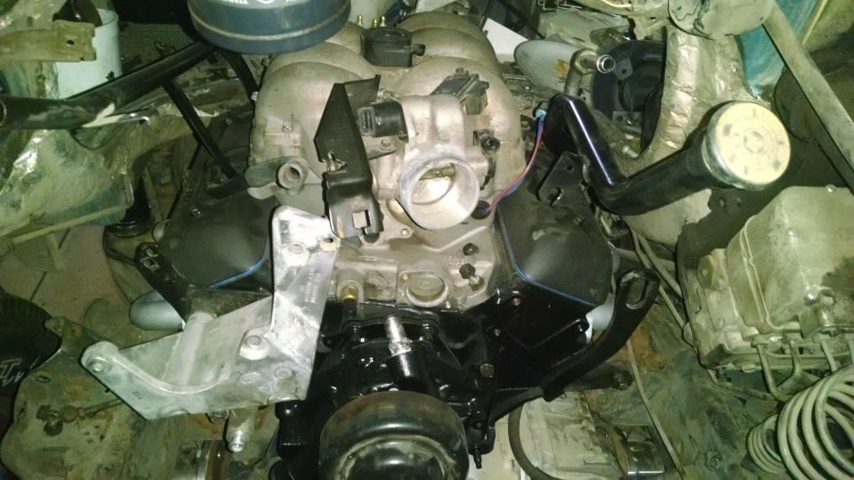 Engine assembly with black painted intake manifold and silver brackets
