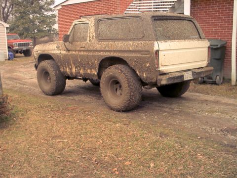 1978 Ford Bronco - This 1978 Ford Bronco is heavily covered in mud, obscuring much of its original appearance.