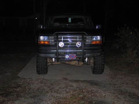 1995 Ford Bronco - 1995 Ford Bronco front view with bull bar and auxiliary lights.