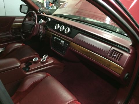 1992 Ford Crown Victoria - The interior of a 1992 Ford Crown Victoria features custom gauges and wood trim accents.