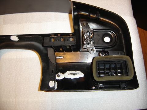 1996 Ford Bronco - Dashboard part with air vent and electrical components, likely removed for repair or modification.