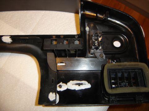 1996 Ford Bronco - Close-up of a disassembled vehicle dashboard panel, showing internal components and an air vent.