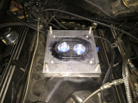 1981 Ford LTD - Starting to cut out the ports. Cut out a pair of circles with a hole saw to get a bunch of material out at once. The adapter fits the studs…