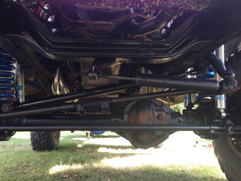1979 Ford Bronco - Undercarriage view shows suspension and steering components of a 4x4 vehicle.
