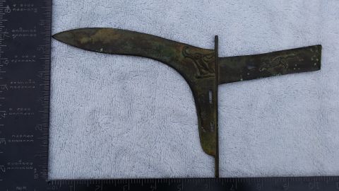 2007 Subaru Impreza - Unidentified metal part with decorative carvings, measured against a ruler.