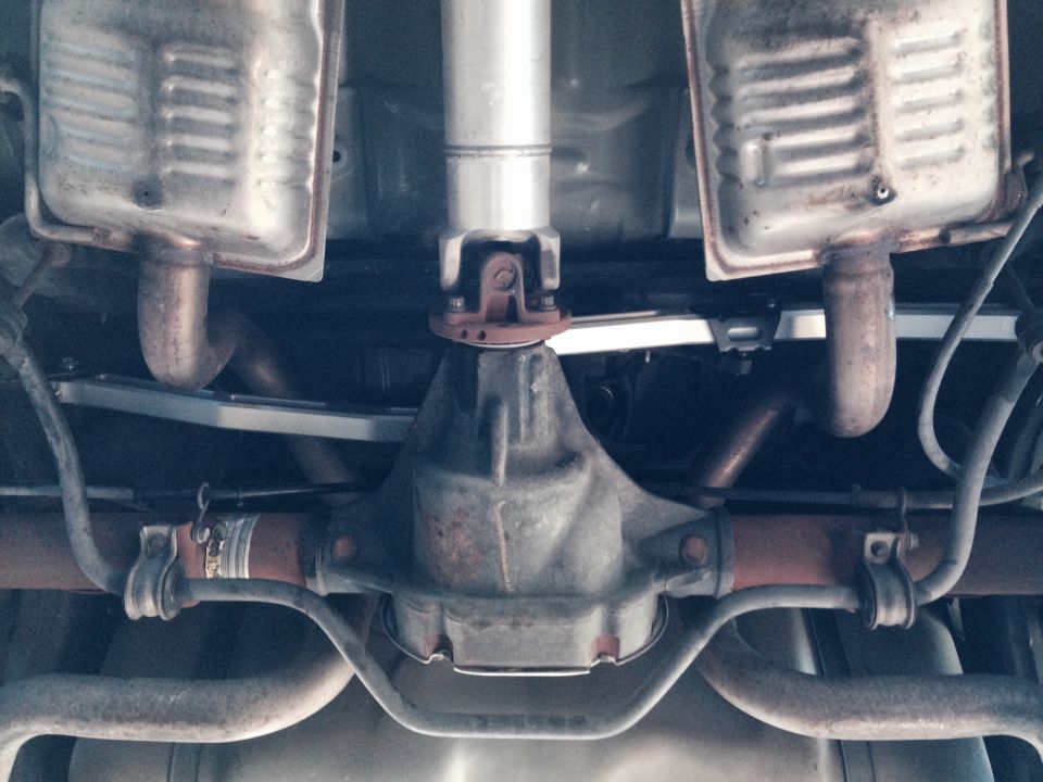 Undercarriage view of a vehicle's rear differential and dual exhaust system