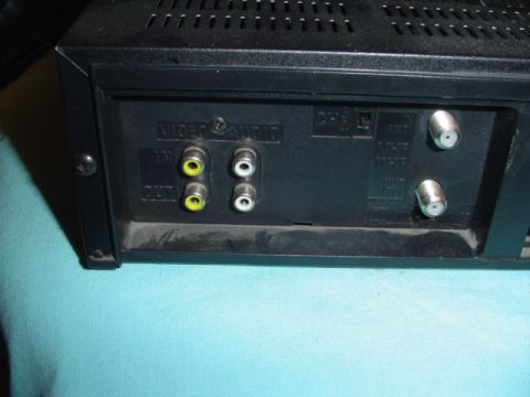 1999 Ford Taurus - The rear panel of a VCR shows various input and output ports for audio, video, and antenna connections.