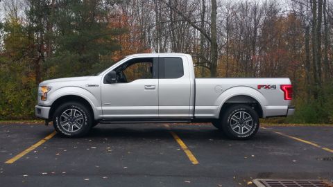 2015 Ford F-150 - A silver 2015 Ford F-150 pickup truck is shown from the side in a parking lot.