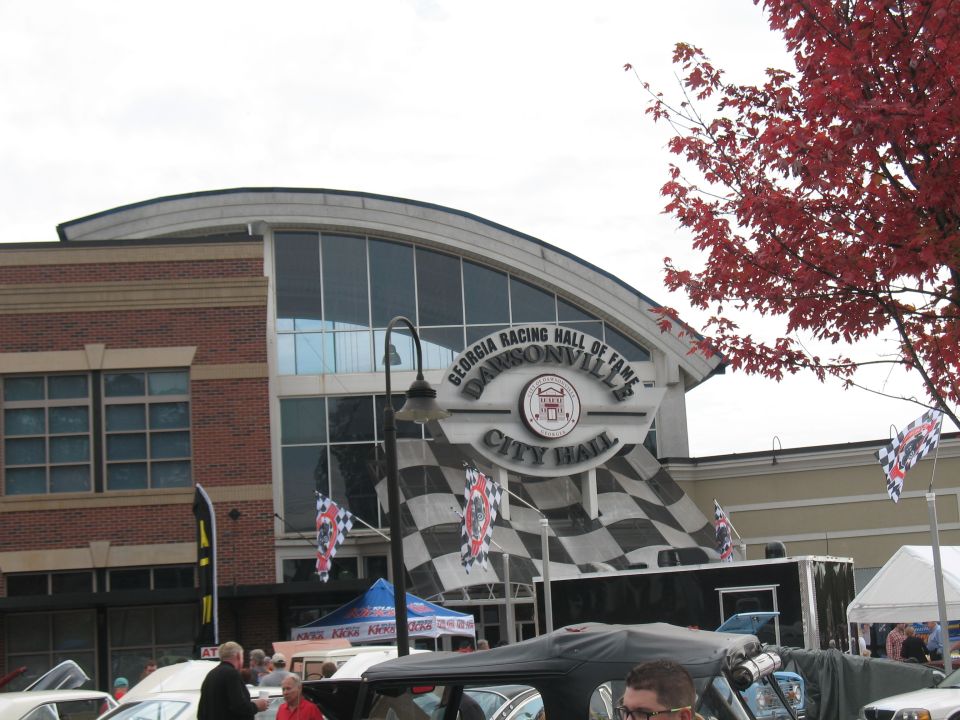 Georgia Racing Hall of Fame building with checkered flags and fall foliage