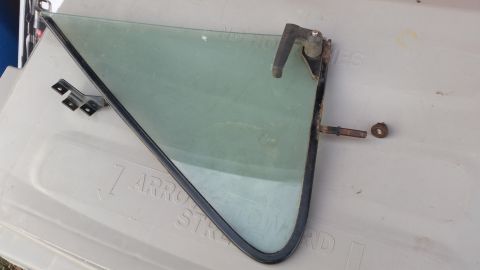 1981 Ford Bronco - A vent window assembly, likely for a classic vehicle, is shown with its mounting hardware and handle.