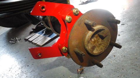 1996 Ford Bronco - Rear caliper bracket adjusted, in place and ready for a caliper (and a little touch up paint - I used fingernail polish)