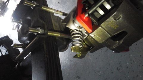 1996 Ford Bronco - Rear suspension component with a red brake caliper visible.