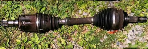 2008 Toyota 4Runner - CV axle shaft part shown on grass.
