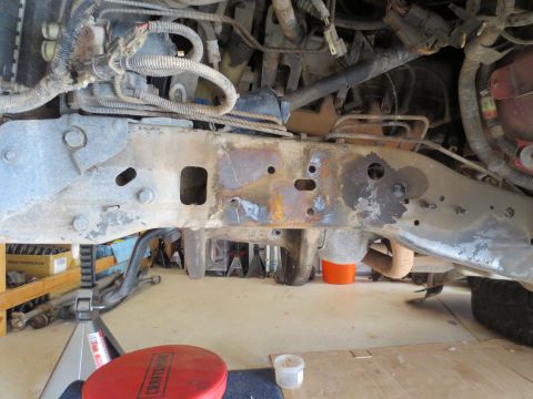 1996 Ford Bronco - The vehicle's frame and undercarriage are visible, with signs of rust and wear on the metal components.