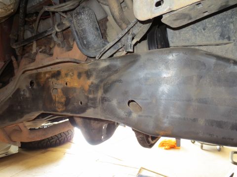 1996 Ford Bronco - Close-up of the vehicle's undercarriage, focusing on the frame and suspension system.