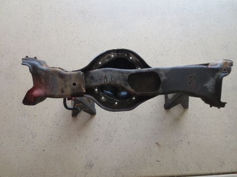 1996 Ford Bronco - Rear axle assembly, likely from a truck or SUV, is shown mounted on jack stands.