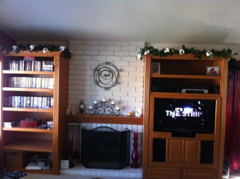 1990 Ford Probe - A living room scene an entertainment center with a television displaying text.