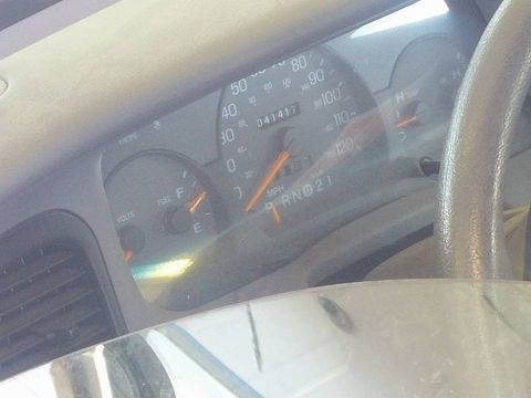 2000 Mercury Grand Marquis - The dashboard gauges show an odometer reading of 041417 and the gear selector is in 'R'.