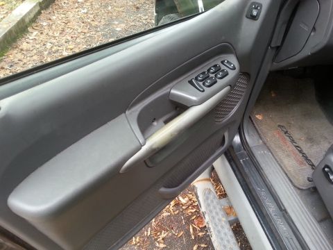 2001 Ford Explorer - The interior door panel and floor mat are visible, with the word "EXPLORER" clearly legible on the mat.
