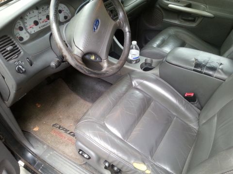 2001 Ford Explorer - Interior view of a 2001 Ford Explorer, including the dashboard, steering wheel, and seats.
