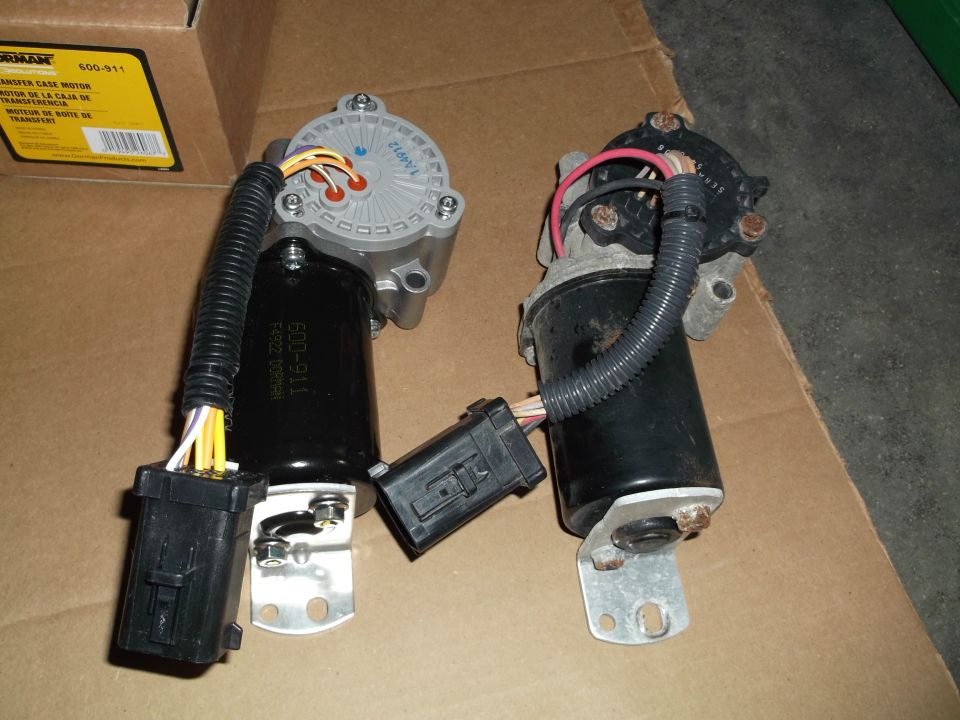 Two transfer case shift motors on a Dorman 600-911 box showing part number 116-009