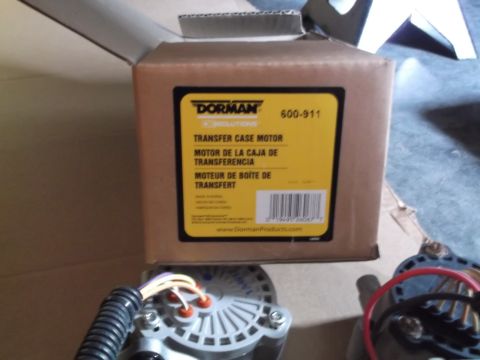 2005 Ford F-150 - A Dorman Transfer Case Motor part is shown in its original packaging, with a partial view of the box and the part itself. The box has yello…