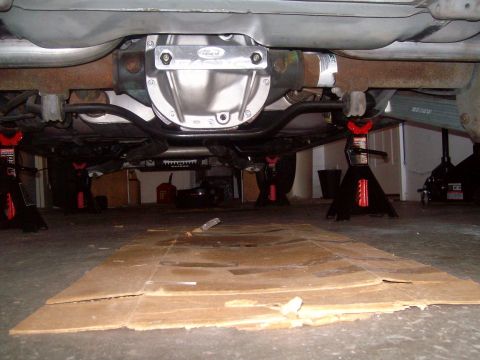 2004 Ford Crown Victoria - The underside of a Ford Crown Victoria is shown, supported by jack stands. The rear differential housing has been upgraded with a polished…