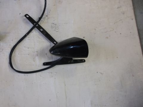 1979 Ford Ranchero - A black, vintage-style bicycle headlight with a mounting bracket and wire is shown against a textured, off-white surface.