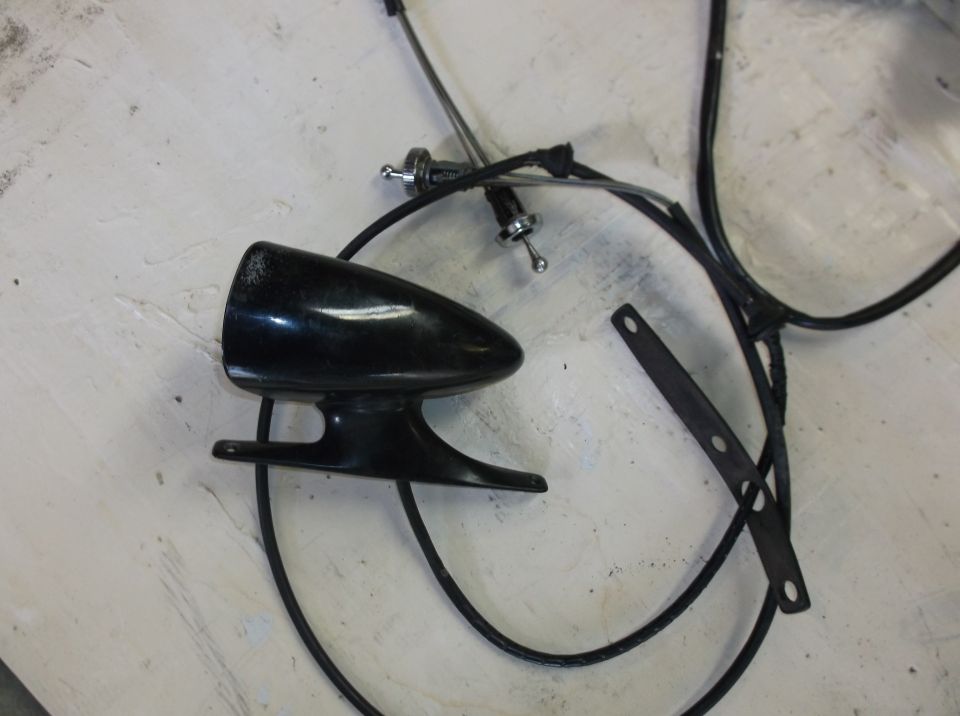 Black teardrop automotive part with wiring and bracket