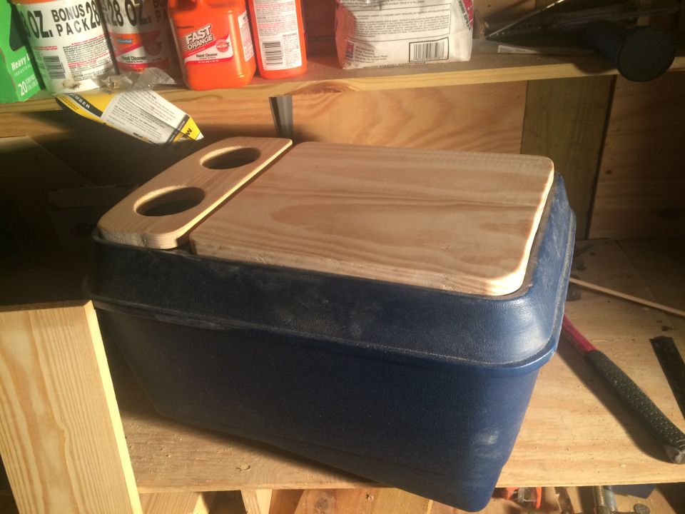 Here is the cupholder and lid mounted.  The lid took the longest.  I joined two pieces of 1X8 pine with a Kreg Jig and then cut it down to size on my mitre saw.  I have a table saw, but did not have a finish blade.  This takes a lot of sanding to get it to fit just right.  I actually overcut the first try and had to do it again.  Get it as a tight fit.  I used the original hinge and mortised a spot on the lid so it would lay flush (with a dremel and chisel - take your time).  You could easily stop here and it would be very nice.  I wanted an armrest and a hidden/lockable compartment.