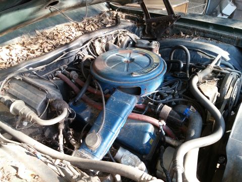 1972 Ford Ranchero - Close-up view of an engine bay, showing mechanical components and hoses.